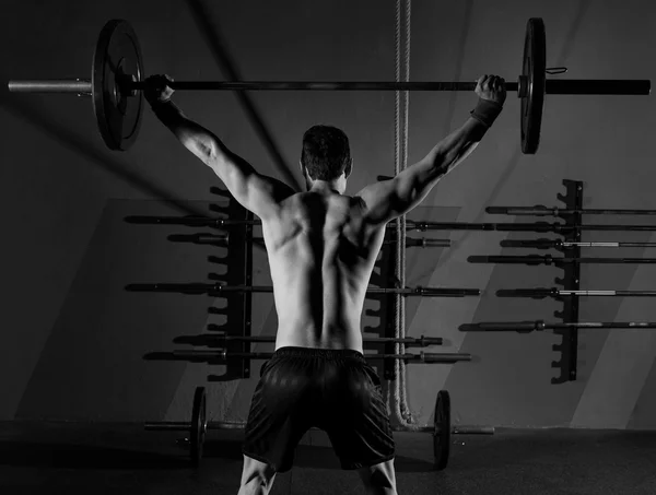 Barbell weight lifting man rear view workout gym — Stock Photo, Image