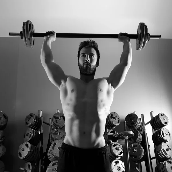 Barbell man workout fitness at weightlifting gym — Stock Photo, Image