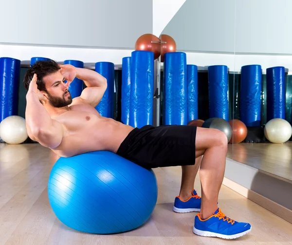 Fitball abdominal crunch Swiss ball man at gym — Stock Photo, Image