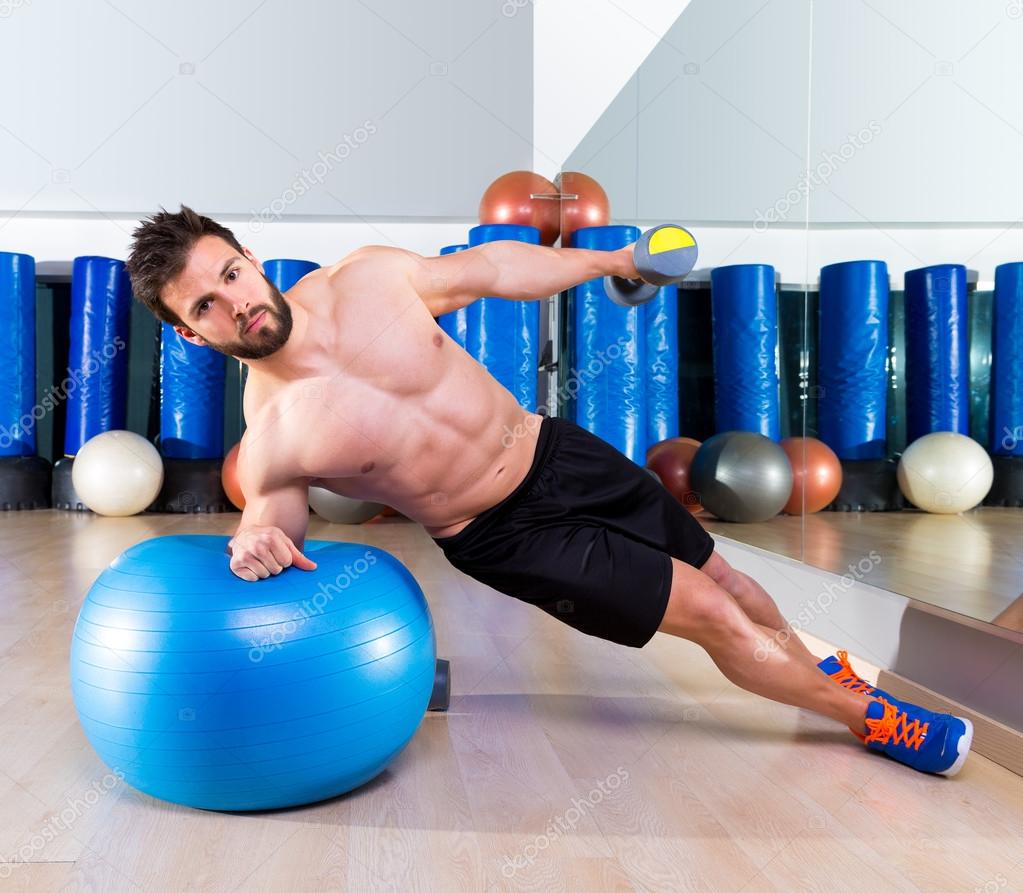 Fitball abdominal side push ups Swiss ball man