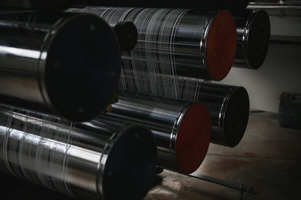 Production of polypropylene yarn for making bags.