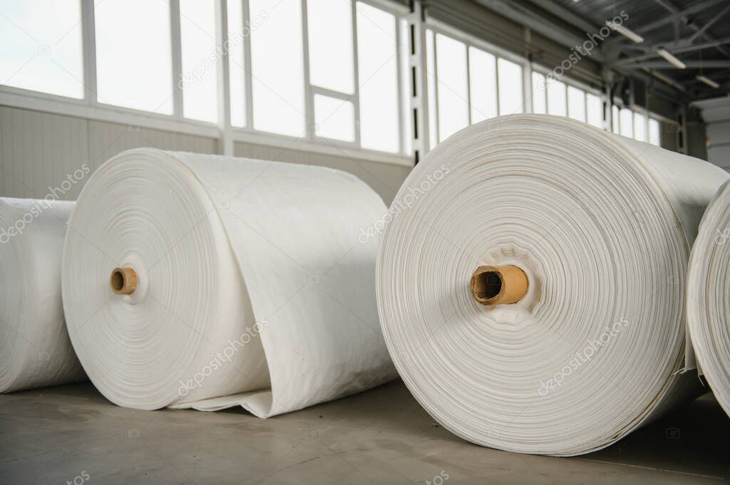 roll of white fabric for cutting
