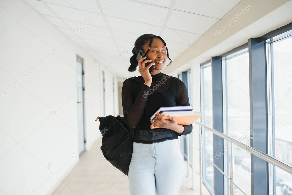 portrait of happy female african american college student