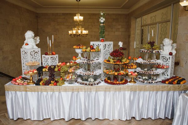 various dessert with fresh fruit on buffet line, sweet