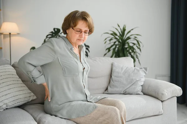 Senior Woman Suffering Back Pain Sofa Home — 图库照片