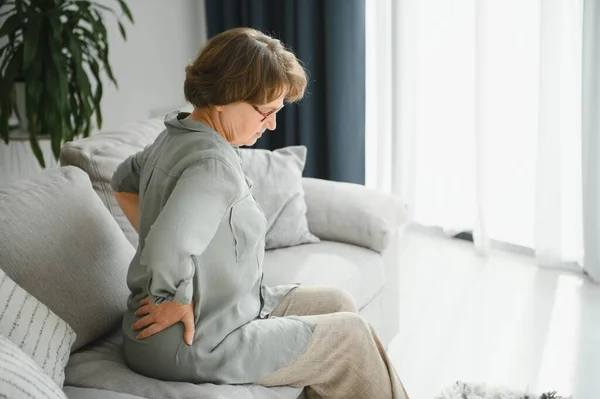 Senior Woman Suffering Back Pain Sofa Home — Foto Stock