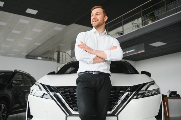 Young Handsome Man Show Room Standing Car Royalty Free Stock Images
