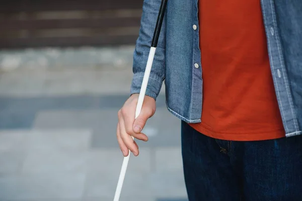 Close-up Of A Blind Man Standing With White Stick On Street.