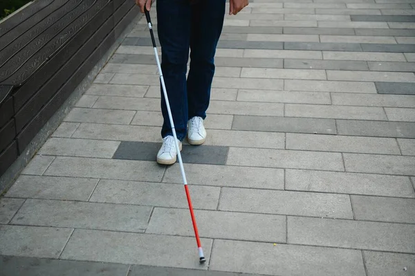 Blind man. People with disability, handicapped person and everyday life. Visually impaired man with walking stick