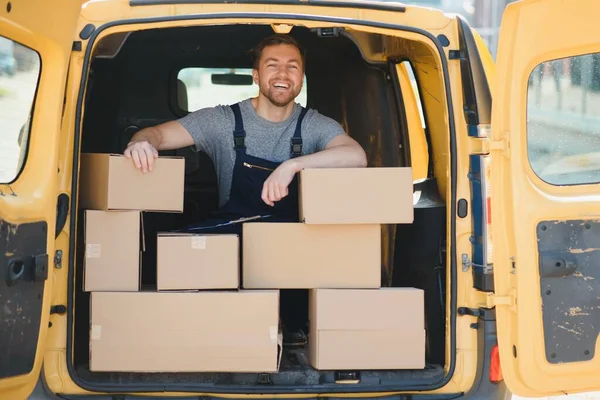 The courier brought the delivery of the box to the client. Courier service employee in uniform