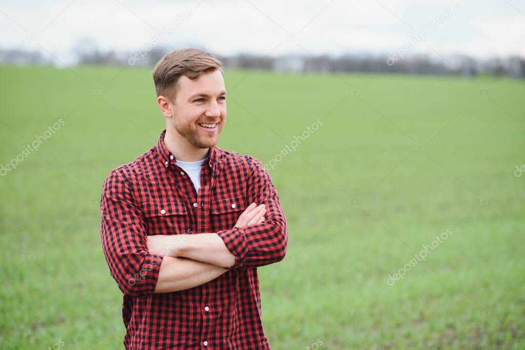 portrait of a young farmer in a field.