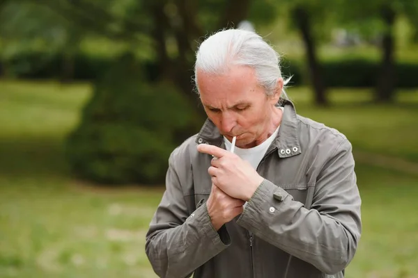 italian man smoking on the street.