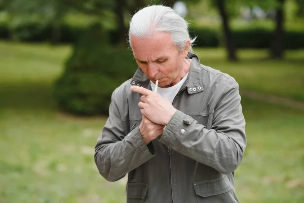 italian man smoking on the street.