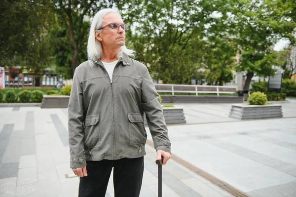 Portrait Senior Man Holding Walking Stick While Resting Park — Stockfoto
