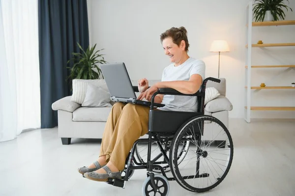 Positive Elderly Woman Wheelchair Working Laptop Freelancer Online — Stock Photo, Image