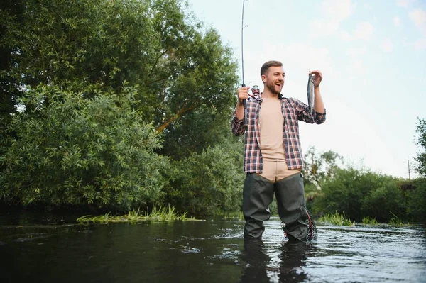 Male hobby. Ready for fishing. Relax in natural environment. Trout bait. Bearded elegant man. Man relaxing nature background. Strategy. Hobby sport activity. Activity and hobby. Catching and fishing.