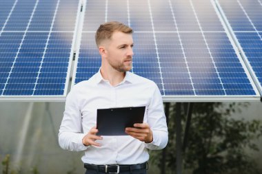 technician checks the maintenance of the solar panels.
