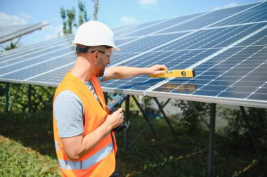 A man working at solar power station