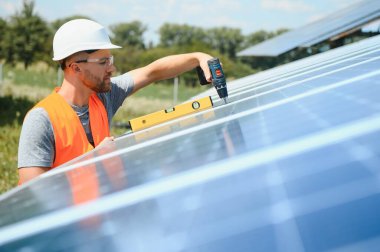 A man working at solar power station