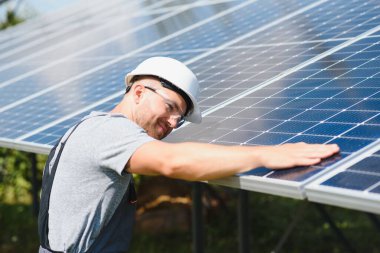 Solar panel. Technician installing solar panels on a sunny day.