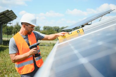 A man working at solar power station