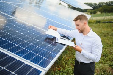technician checks the maintenance of the solar panels.