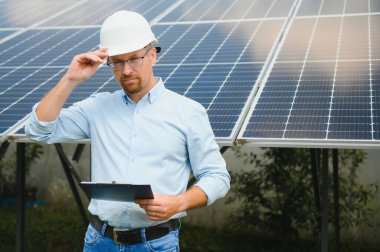 technician checks the maintenance of the solar panels.