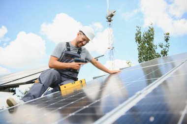 A man working at solar power station