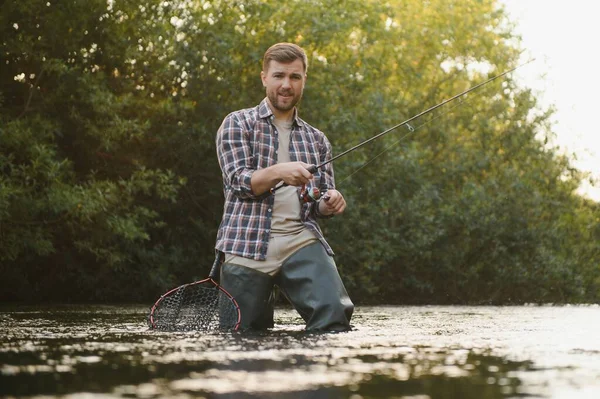 Male hobby. Ready for fishing. Relax in natural environment. Trout bait. Bearded elegant man. Man relaxing nature background. Strategy. Hobby sport activity. Activity and hobby. Catching and fishing.