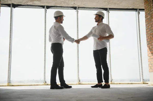 stock image two business man construction site engineer