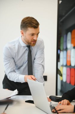 A group of business people partners during a set team meeting in the modern office. Teamwork concept.