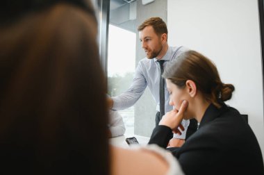 A group of business people partners during a set team meeting in the modern office. Teamwork concept.