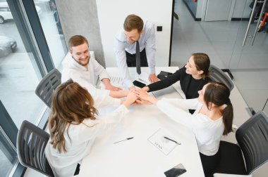 A group of business people partners during a set team meeting in the modern office. Teamwork concept.