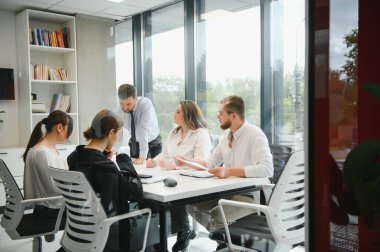 A group of business people partners during a set team meeting in the modern office. Teamwork concept.