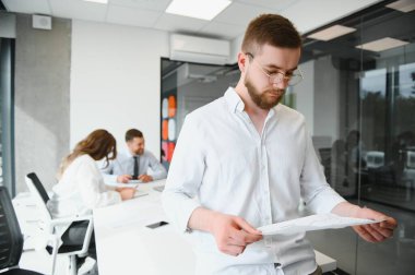 Portrait of a leader with business team behind