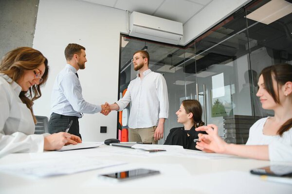 Corporate business team and in a meeting at modern office with big windows . High quality photo.