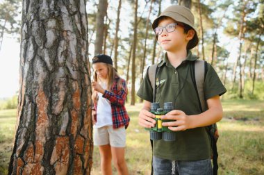 kids scouts in the forest