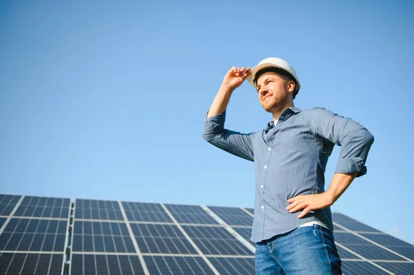 The solar farm(solar panel) with engineer check the operation of the system, Alternative energy to conserve the world\'s energy, Photovoltaic module idea for clean energy production.