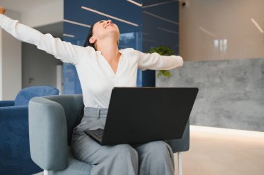 Photo of young attractive woman happy positive smile rejoice victory fists hands achievement look laptop