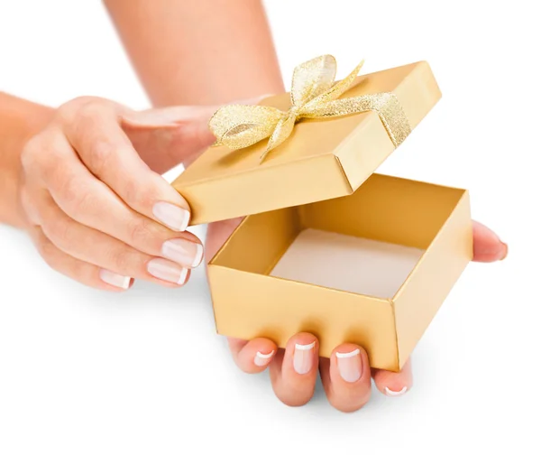 Hands holding an opened gift box — Stock Photo, Image