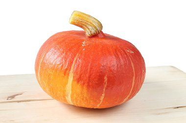 Hokkaido pumpkin on a cutting board clipart