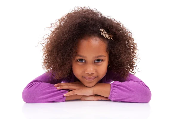 Cute little African Asian girl lying down on the floor — Stock Photo, Image