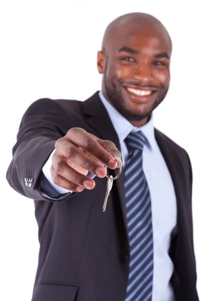 Young African American businessman holding a house key Stock Photo