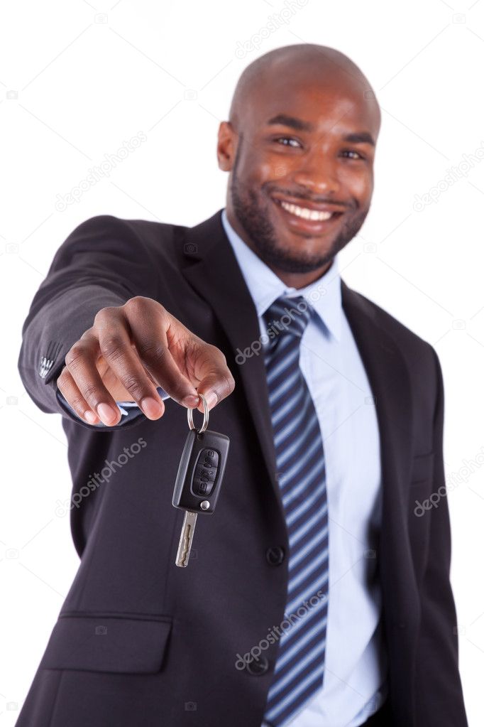 Young African American businessman holding a car key