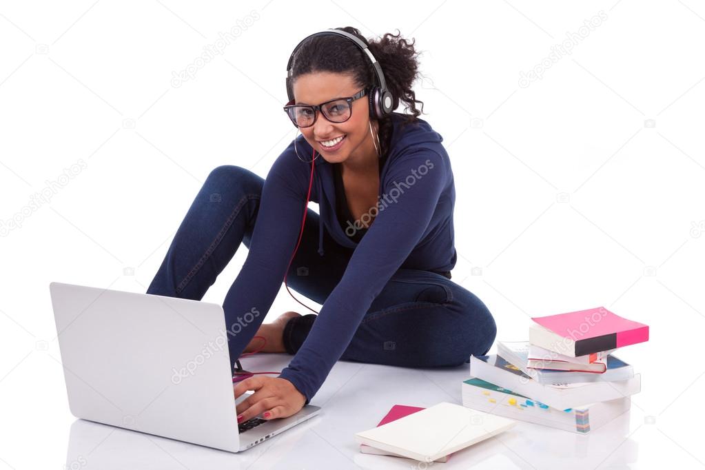 Young African student girl using a computer