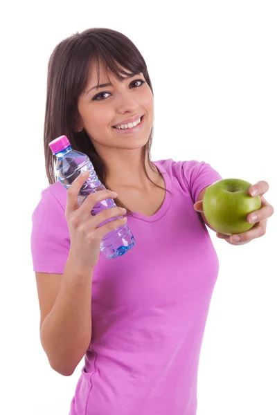 Joven mujer caucásica sosteniendo una botella de agua y una manzana — Foto de Stock