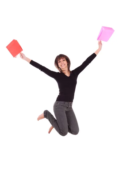 Feliz mujer caucásica saltando con bolsas de compras —  Fotos de Stock