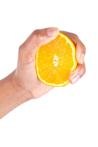 African American hand squeezing an orange slice — Stock Photo, Image