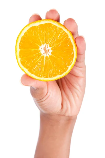 African American hand holding an orange slice — Stock Photo, Image