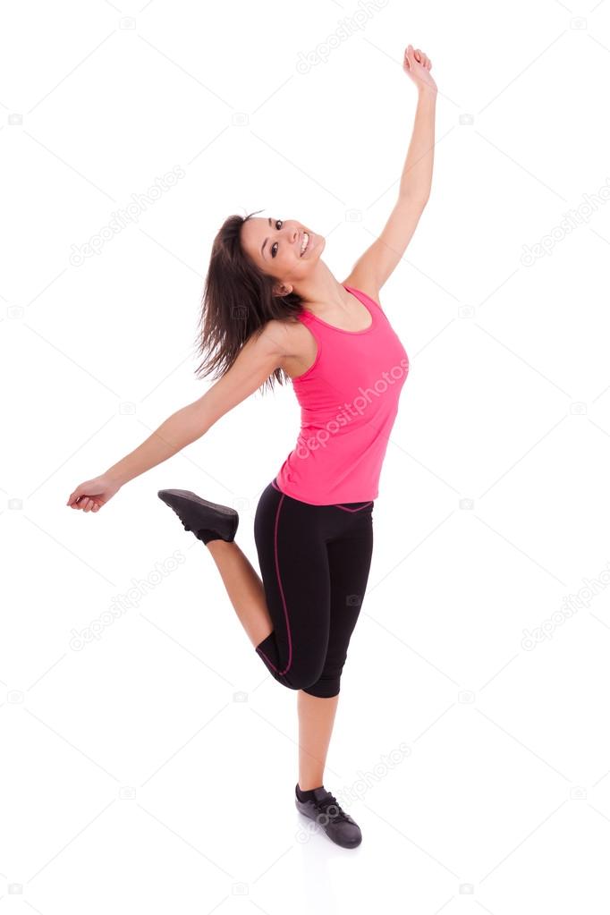 Young beautiful caucasian fitness woman dancing